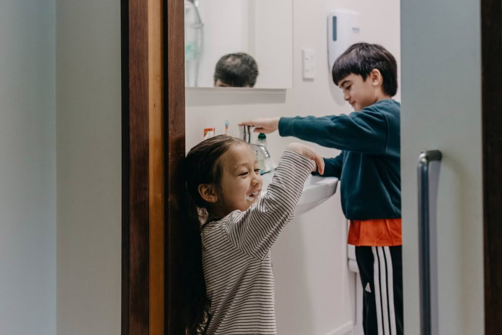 Children brushing their teeth in Ronald McDonald House room